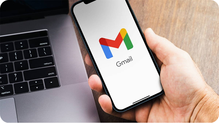 Hand holding phone with Gmail open